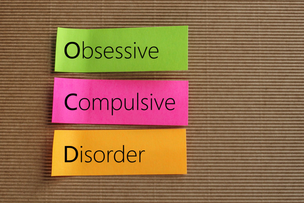 Obsessive compulsive disorder written on different colored reminder tabs
